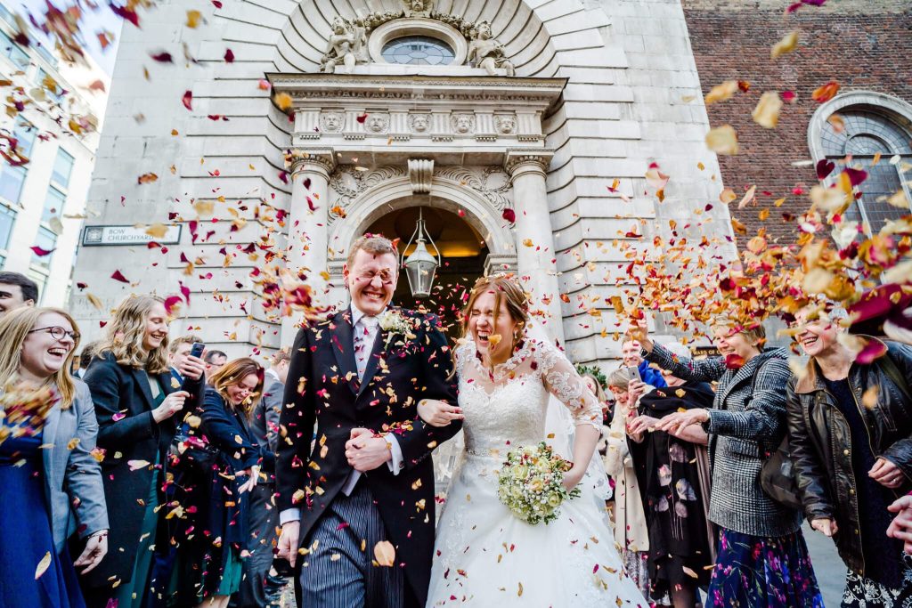 Bride and groom leave Mary-le-bow chuch on Cheapside through a cloud of confetti
